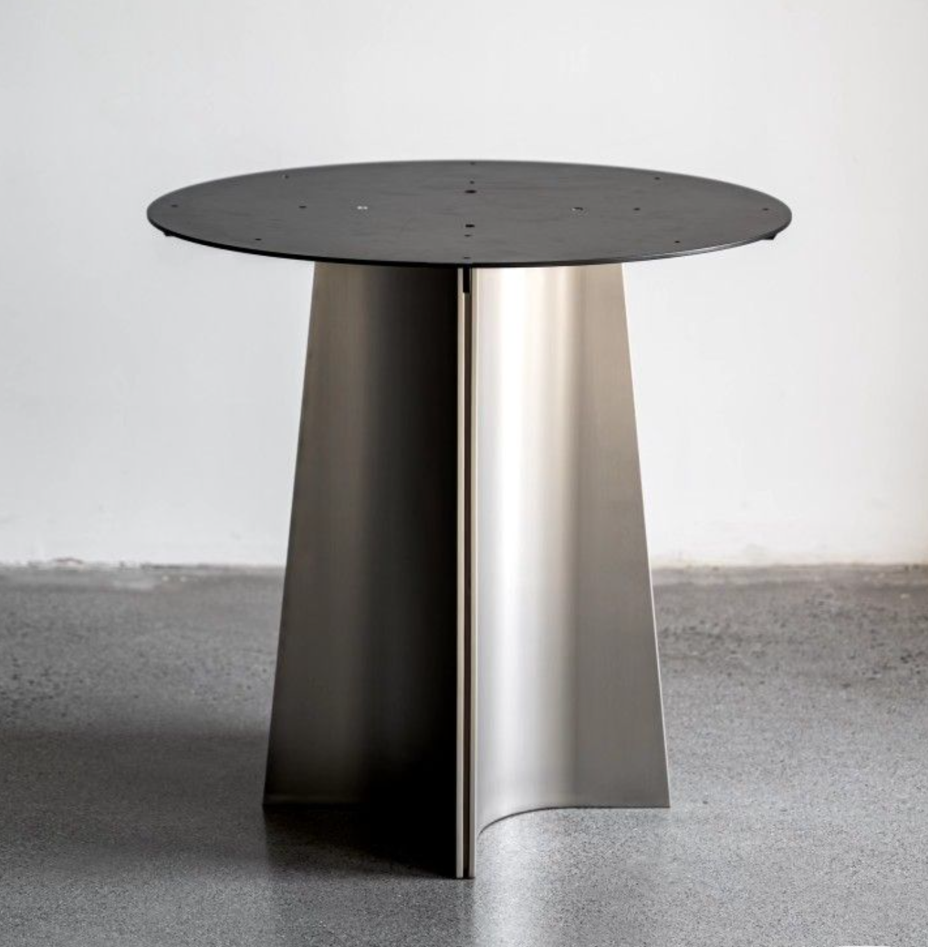 Handcrafted custom base detail in brushed steel
